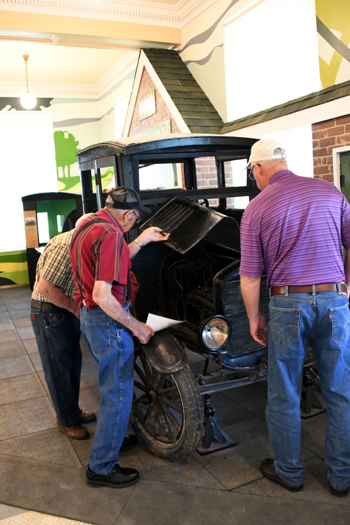 090 Curtis Huber, Glen Bower, Carl Brown examine the vintage truck in the Mead Museum.JPG